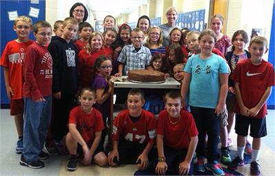 Students around the 'Bruce Bogtrotter' giant cake